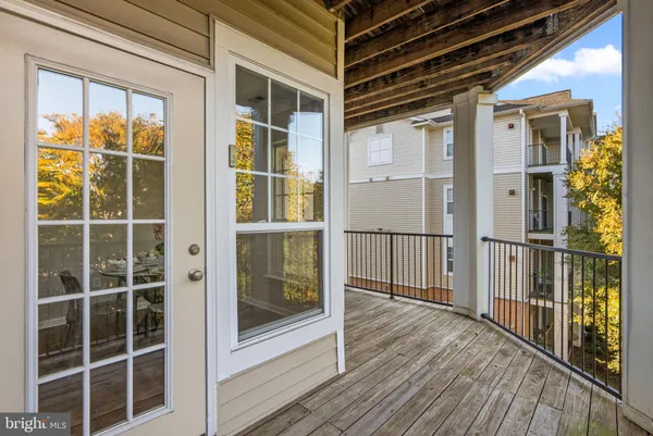 a view of front door and deck of the house