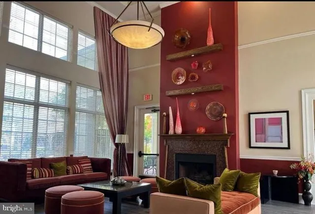 a living room with furniture a dining table and a fireplace