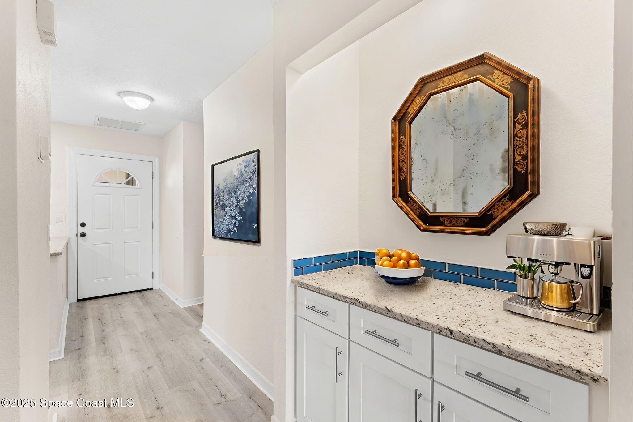 129 Seawind Drive, Unit 25 Satellite Beach, FL 32937 - Photo 3 of 28 a bathroom with a sink and a mirror