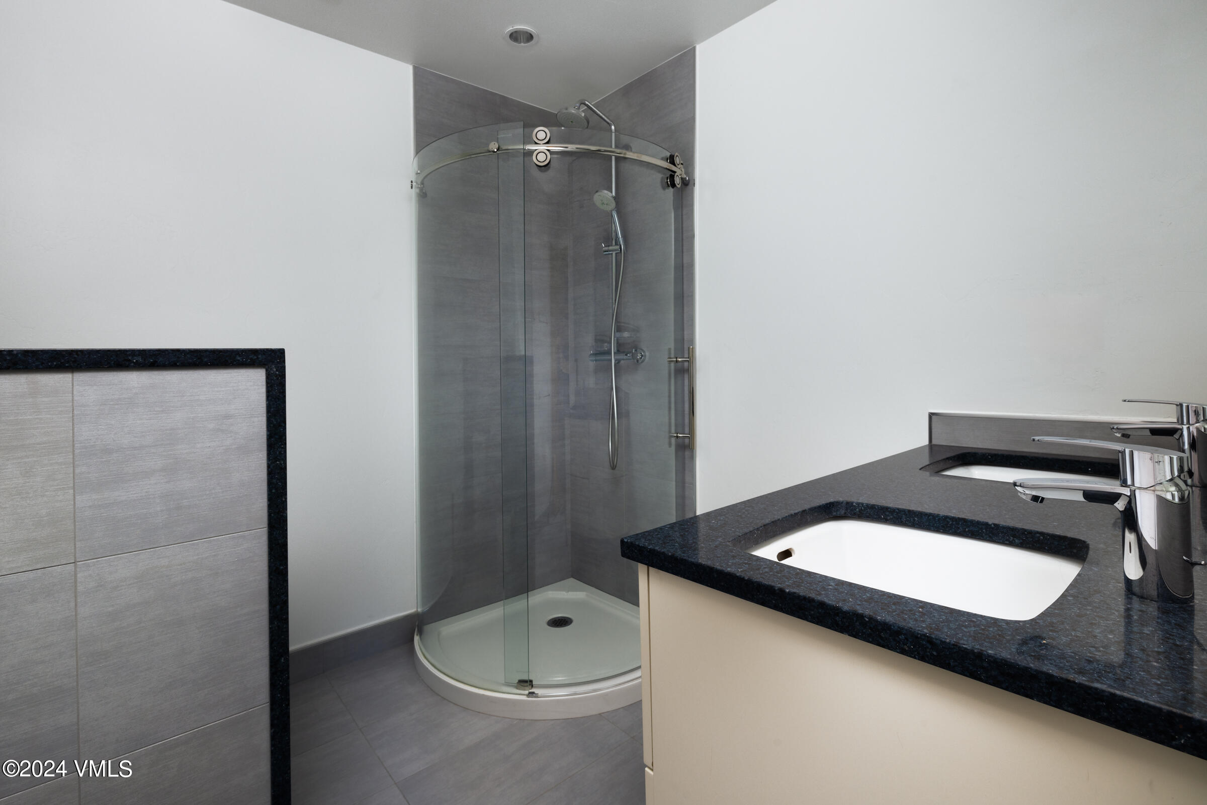 15 Highlands Lane, Unit R407 Beaver Creek, CO 81620 - Photo 12 of 18 a bathroom with a sink and mirror