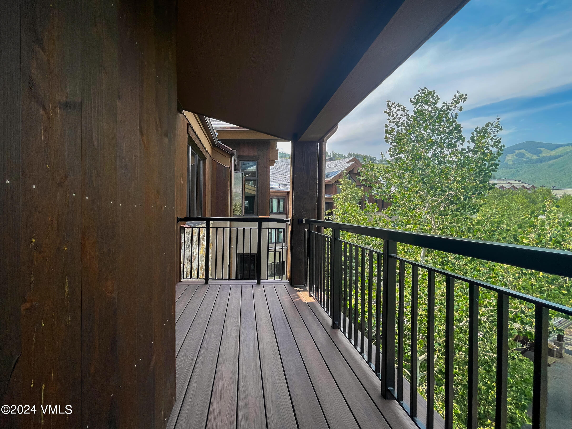 15 Highlands Lane, Unit R407 Beaver Creek, CO 81620 - Photo 13 of 18 a view of a balcony with wooden floor