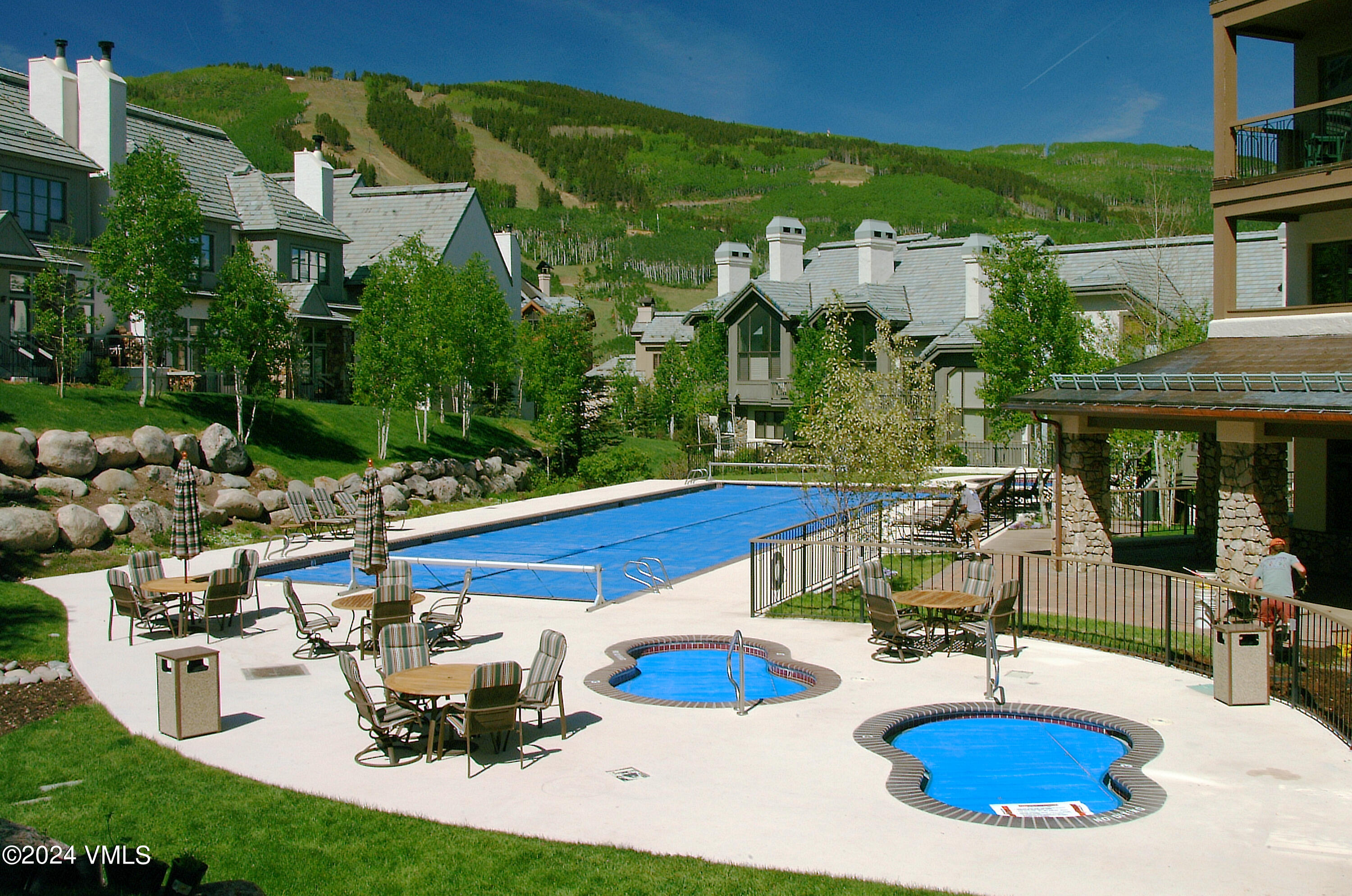 15 Highlands Lane, Unit R407 Beaver Creek, CO 81620 - Photo 16 of 18 a view of a house with backyard water fountain and sitting area