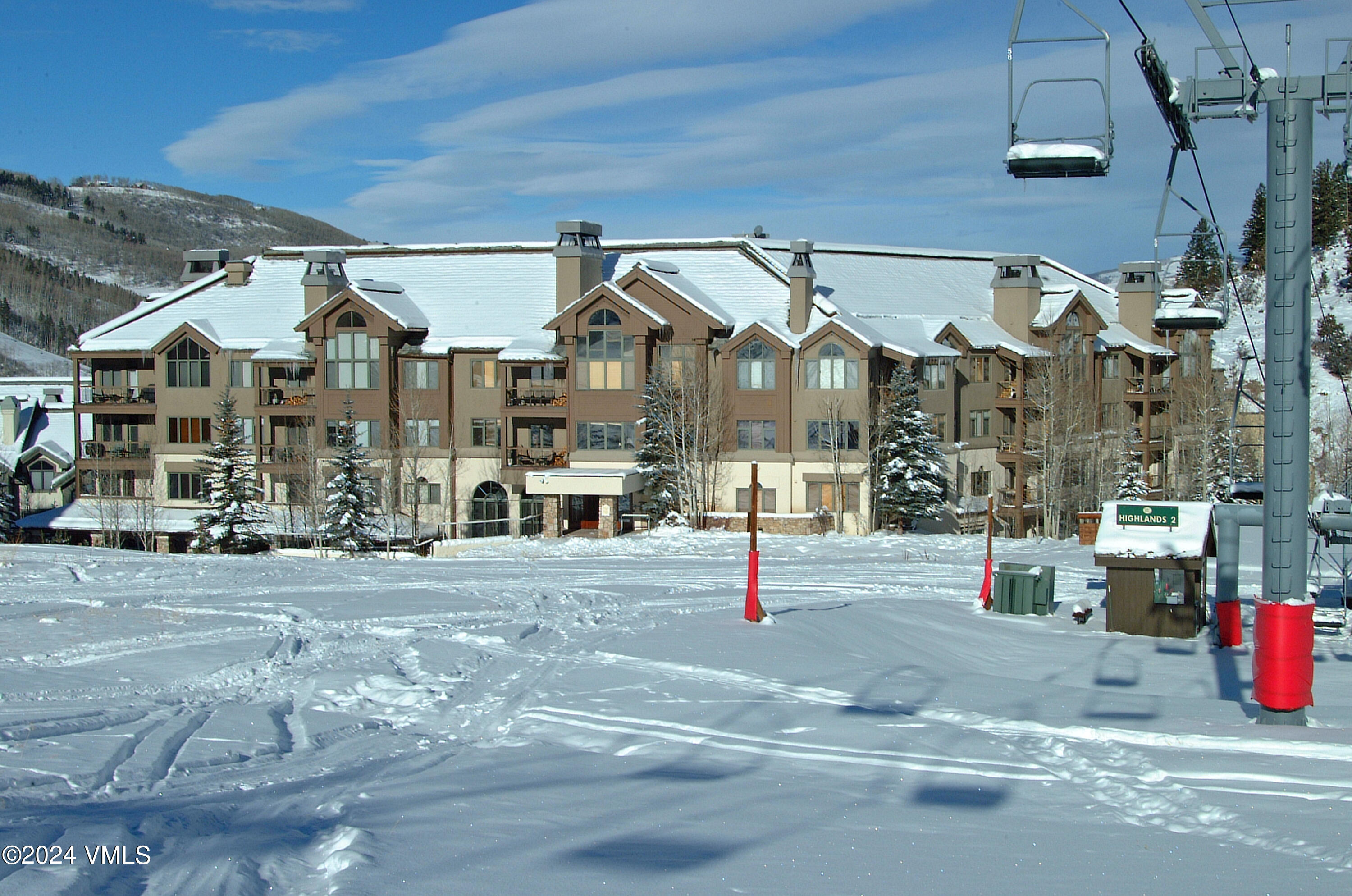 15 Highlands Lane, Unit R407 Beaver Creek, CO 81620 - Photo 17 of 18 a front view of a building with street