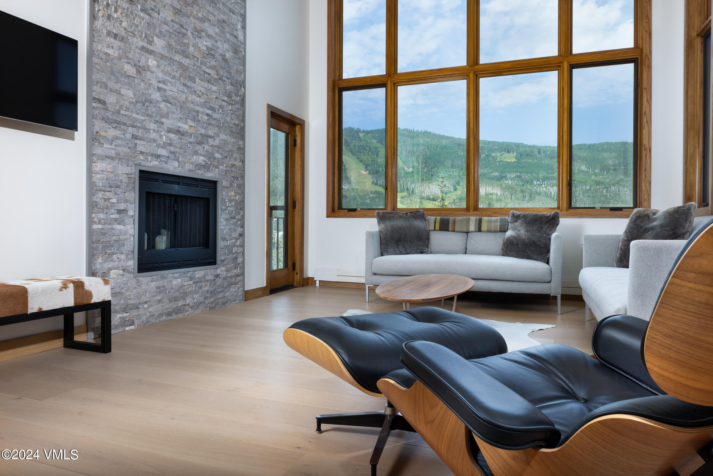 15 Highlands Lane, Unit R407 Beaver Creek, CO 81620 - Photo 2 of 18 a living room with furniture and a fireplace