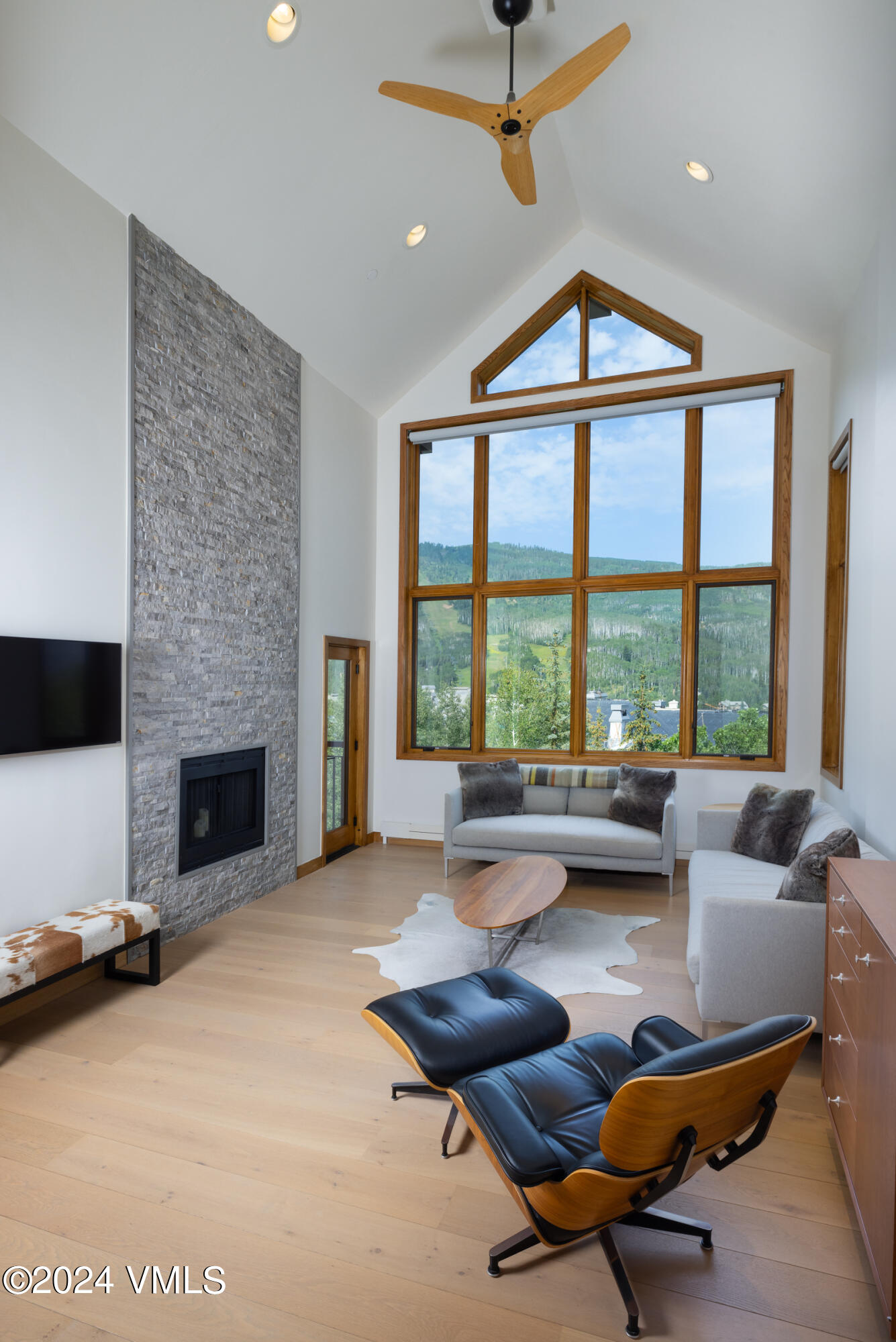 15 Highlands Lane, Unit R407 Beaver Creek, CO 81620 - Photo 3 of 18 a living room with furniture large window and a fireplace
