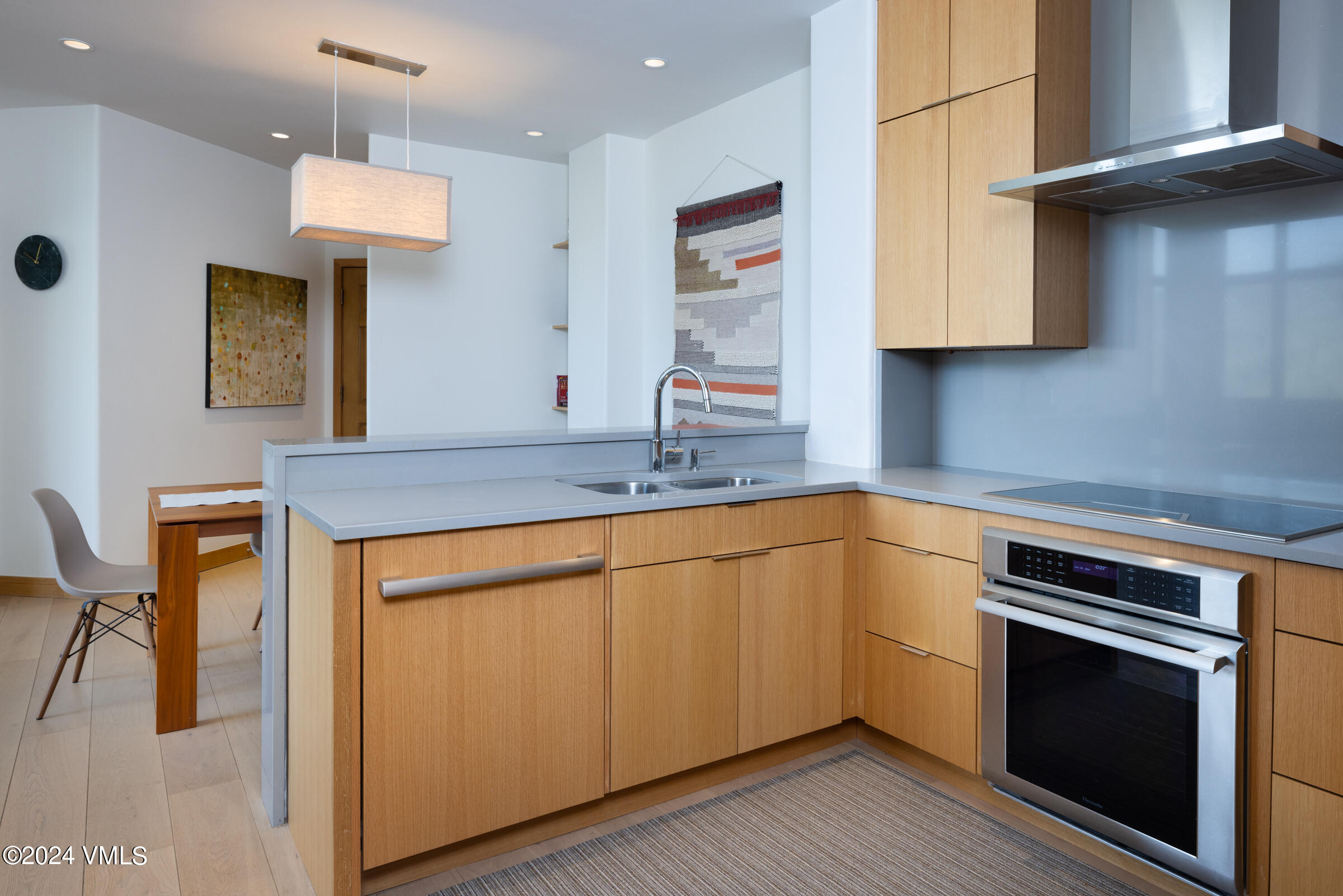 15 Highlands Lane, Unit R407 Beaver Creek, CO 81620 - Photo 6 of 18 a kitchen with stainless steel appliances granite countertop a sink and a refrigerator