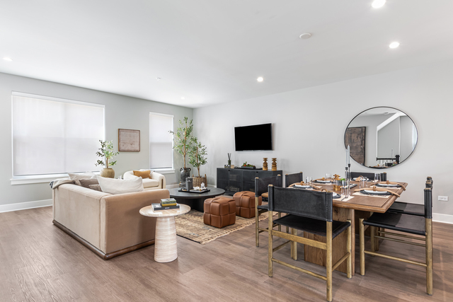 5424 Old Orchard Road Skokie, IL 60077 - Photo 12 of 56 a living room with furniture a flat screen tv and a large window