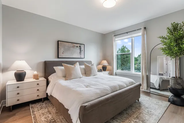 a bathroom with a double vanity sink toilet and a mirror