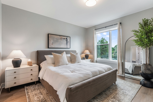 5424 Old Orchard Road Skokie, IL 60077 - Photo 17 of 56 a bedroom with a large bed and a window