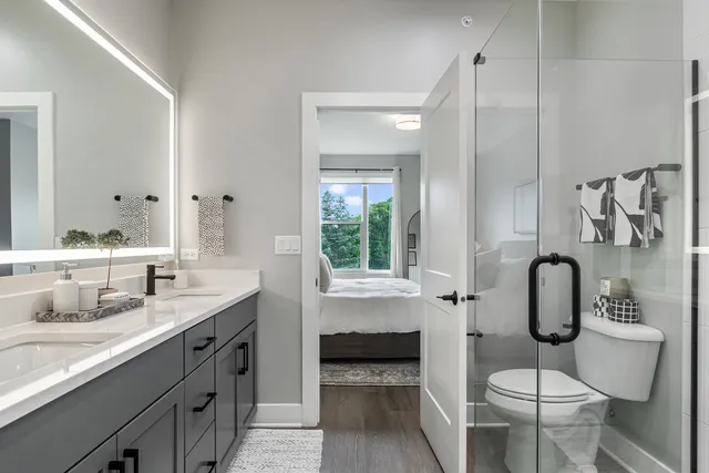 a bathroom with a sink double vanity and a shower