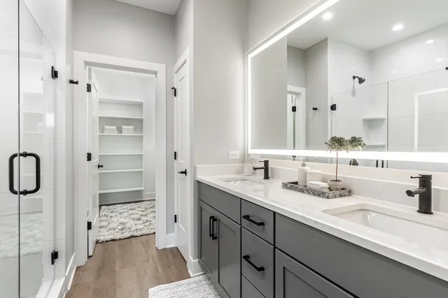 a view of walk in closet with empty racks
