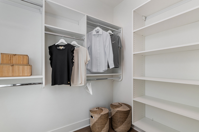 5424 Old Orchard Road Skokie, IL 60077 - Photo 23 of 56 a view of walk in closet with clothes and shoes