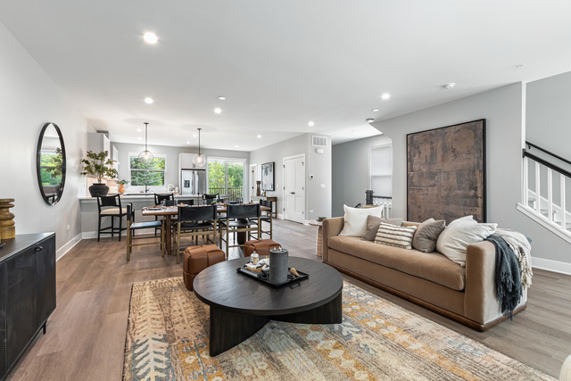 5424 Old Orchard Road Skokie, IL 60077 - Photo 3 of 56 a living room with furniture a rug kitchen view and a large window