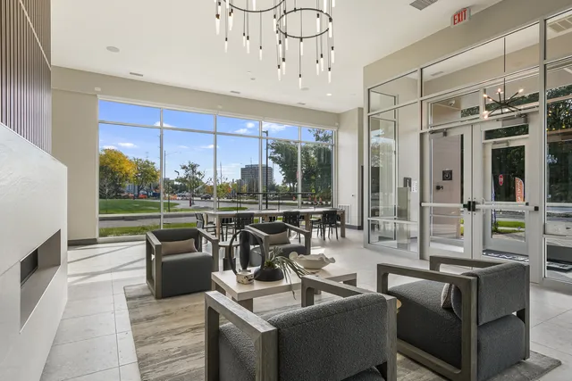 a dining room filled with furniture and window