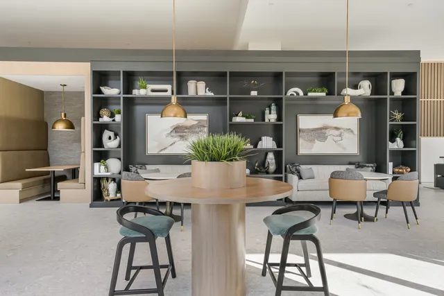 a view of a a dining room with furniture window and wooden floor