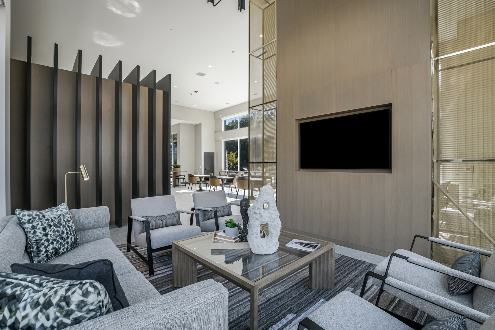 5424 Old Orchard Road Skokie, IL 60077 - Photo 46 of 56 a living room with furniture a flat screen tv and kitchen view