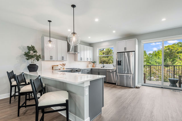 5424 Old Orchard Road Skokie, IL 60077 - Photo 6 of 56 a kitchen with refrigerator and chairs