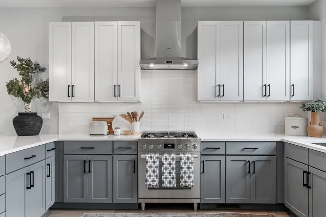 a kitchen with stainless steel appliances a refrigerator and wooden floor
