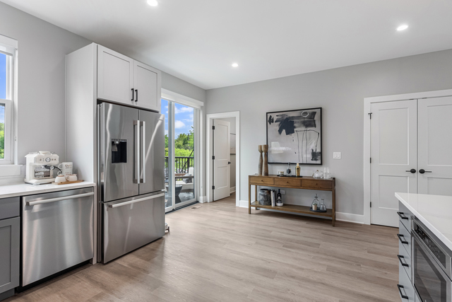 5424 Old Orchard Road Skokie, IL 60077 - Photo 9 of 56 a kitchen with stainless steel appliances a refrigerator and wooden floor