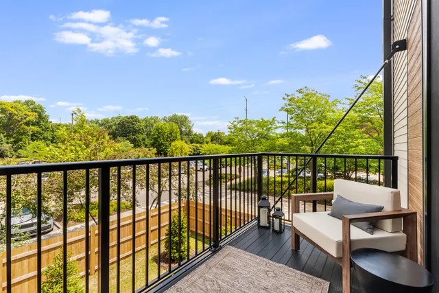 a view of a balcony with chairs