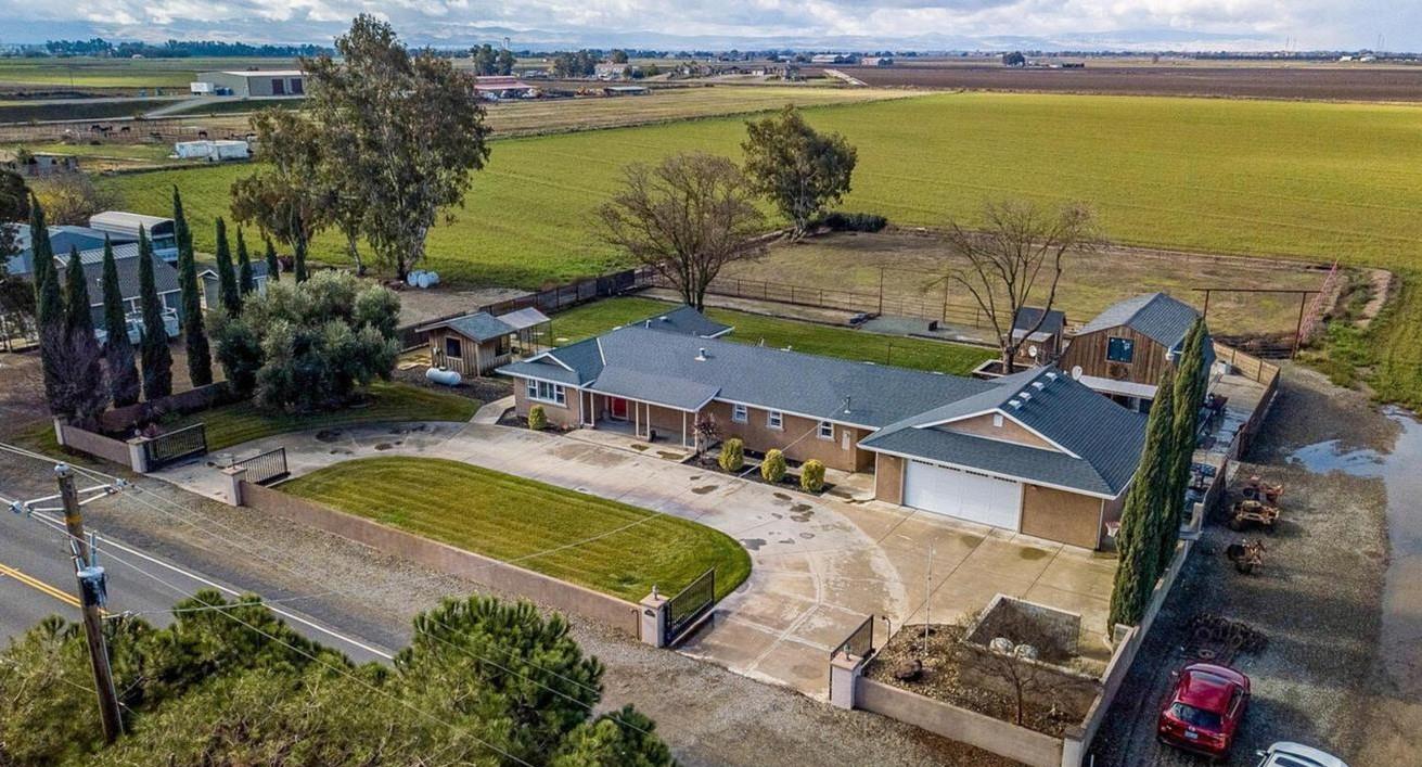 an aerial view of a house with a ocean view