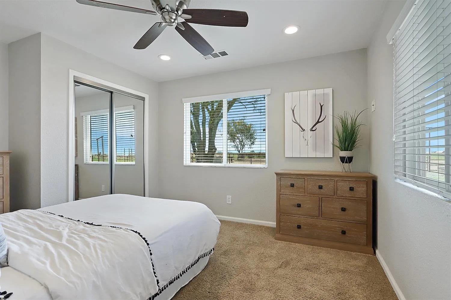 18393 Paradise Road Tracy, CA 95304 - Photo 12 of 36 a bedroom with a bed and a dresser
