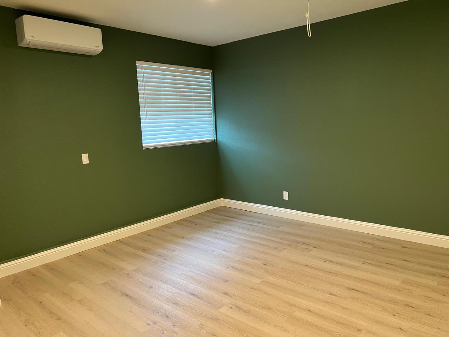 18393 Paradise Road Tracy, CA 95304 - Photo 30 of 36 a view of empty room with wooden floor