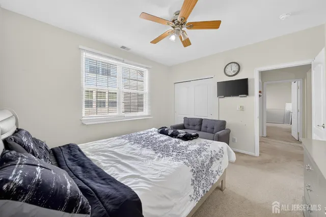 a bathroom with a sink toilet and mirror