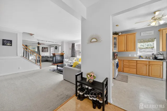 a kitchen with stainless steel appliances granite countertop a refrigerator sink and cabinets