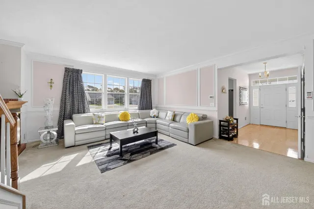 a living room with furniture and a table