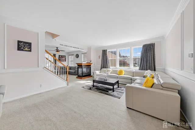 a view of a livingroom with furniture and window