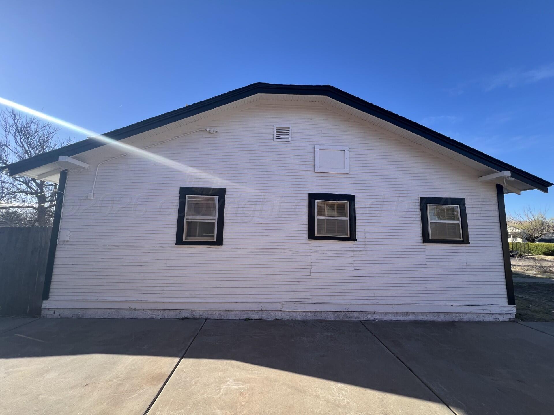 3407 South Harrison Street Amarillo, TX 79109 - Photo 4 of 8 a view of a house with roof