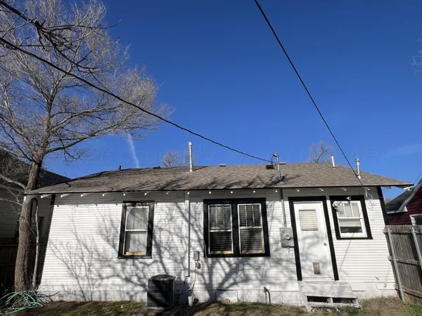 a view of a house with a street