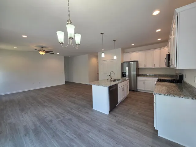 a view of a livingroom with wooden floor