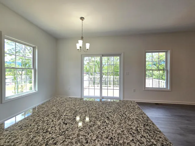 a balcony with wooden floor and city view