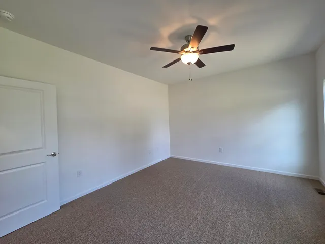 a view of empty room with windows