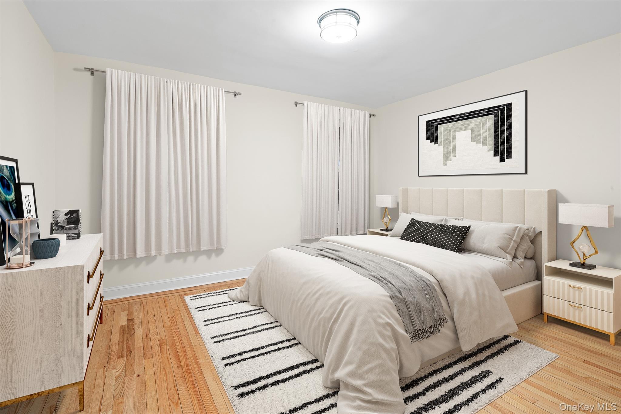 110-07 73rd Road, Unit 2K Queens, NY 11375 - Photo 6 of 17 a bedroom with a bed and a large mirror