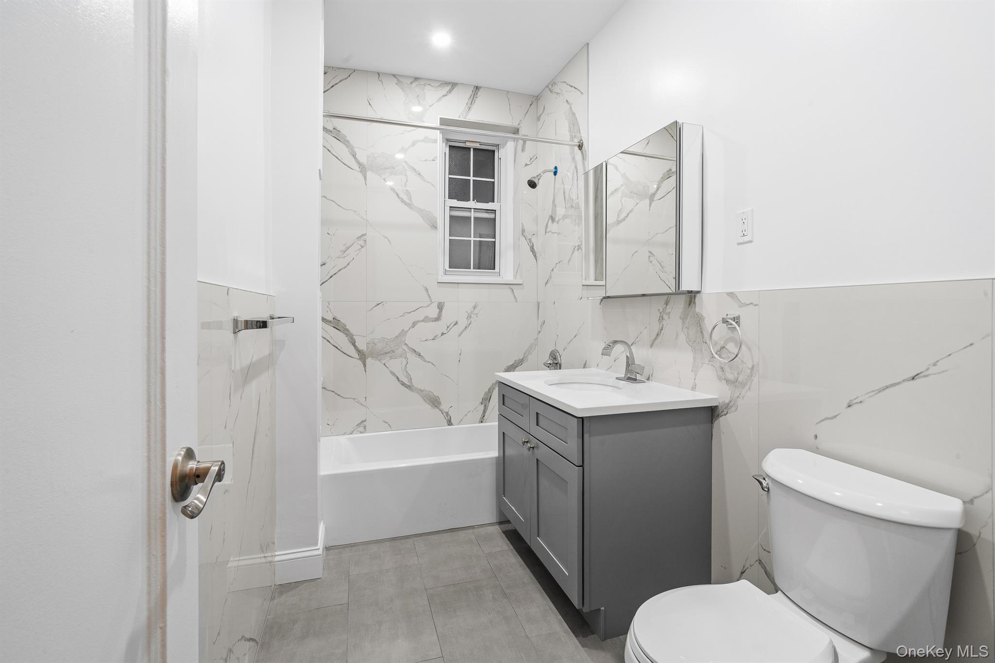 110-07 73rd Road, Unit 2K Queens, NY 11375 - Photo 7 of 17 a bathroom with a sink toilet and shower