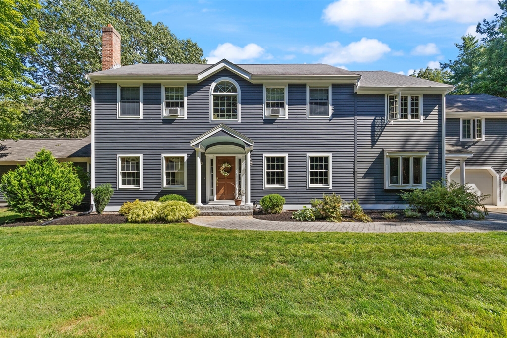 26 Cross Road Boxford, MA 01921 - Photo 1 of 41 a front view of a house with garden and porch
