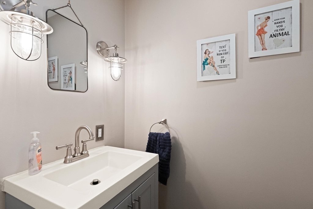 26 Cross Road Boxford, MA 01921 - Photo 14 of 41 a bathroom with a sink vanity and mirror