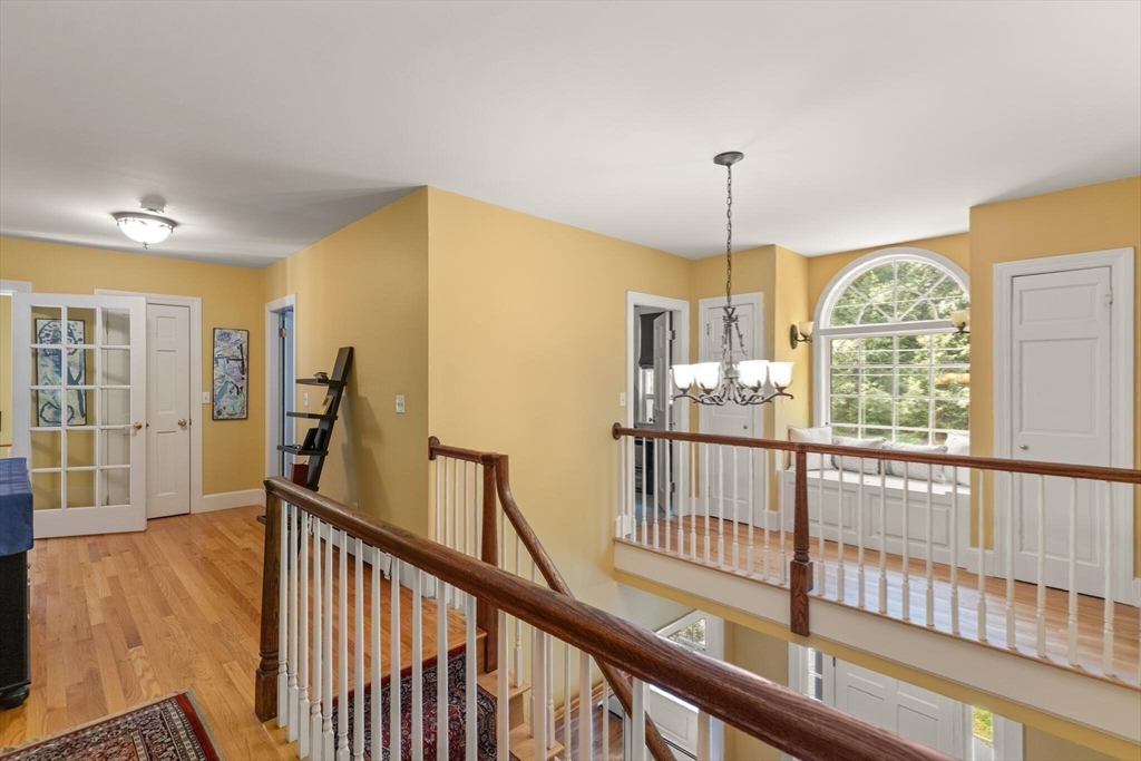 26 Cross Road Boxford, MA 01921 - Photo 18 of 41 a view of an entryway with wooden floor