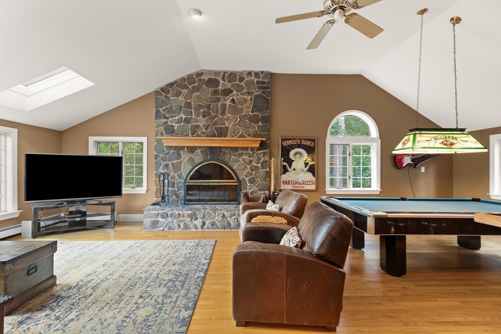 26 Cross Road Boxford, MA 01921 - Photo 19 of 41 a living room with furniture and a flat screen tv
