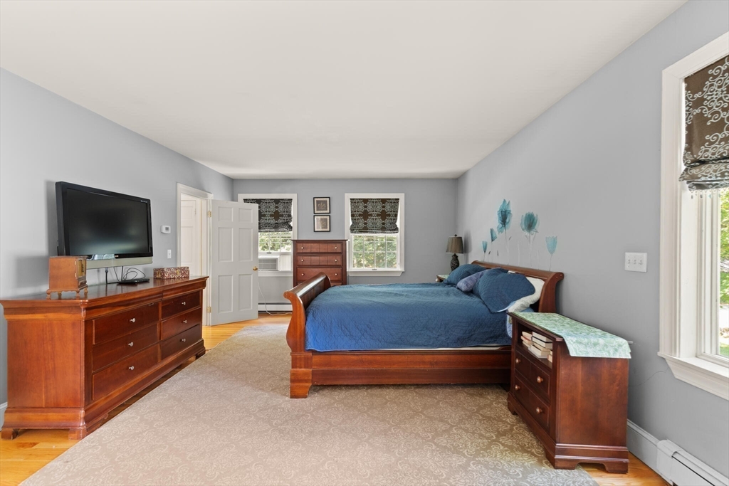 26 Cross Road Boxford, MA 01921 - Photo 27 of 41 a bed room with furniture and a flat screen tv