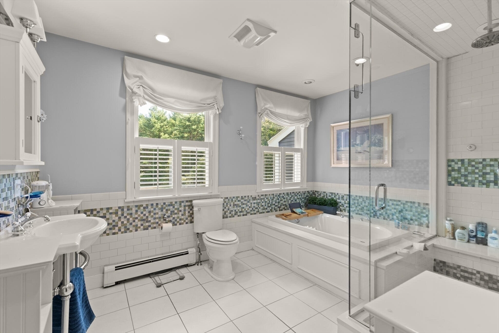 26 Cross Road Boxford, MA 01921 - Photo 28 of 41 a bathroom with a tub sink toilet and mirror