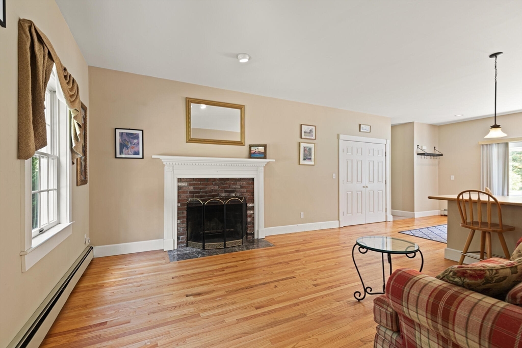 26 Cross Road Boxford, MA 01921 - Photo 30 of 41 a living room with furniture and a fireplace
