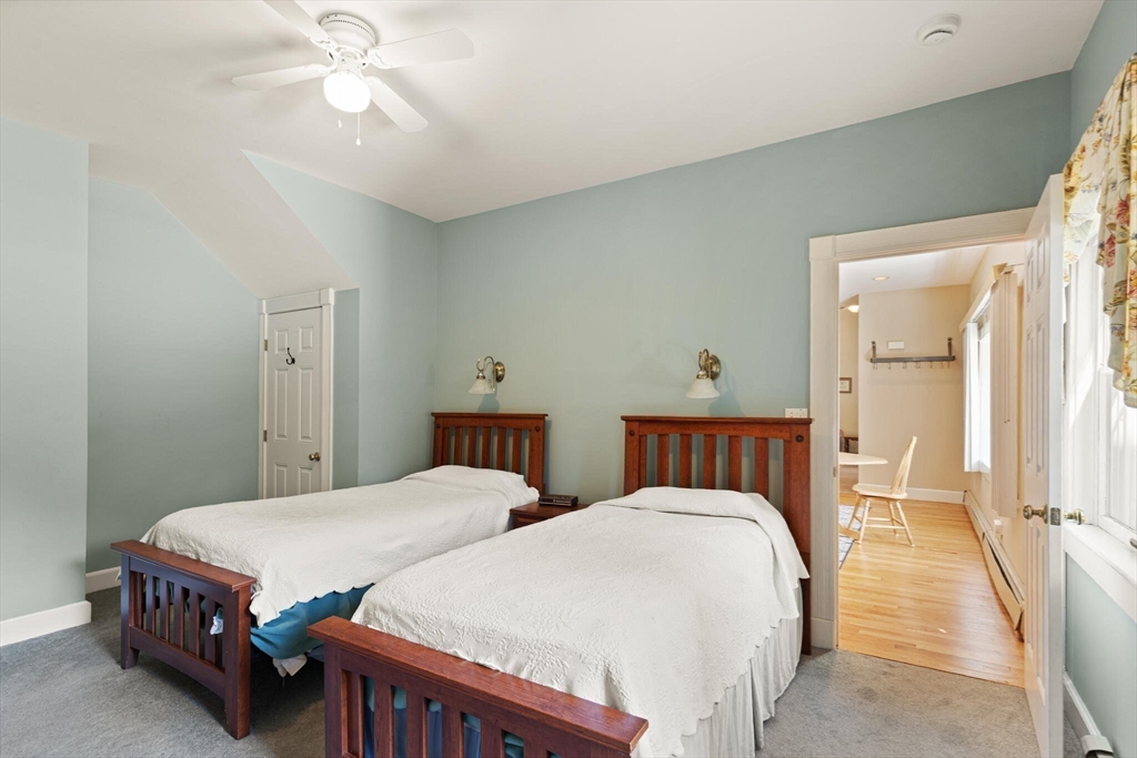 26 Cross Road Boxford, MA 01921 - Photo 32 of 41 a bedroom with two beds and a chandelier