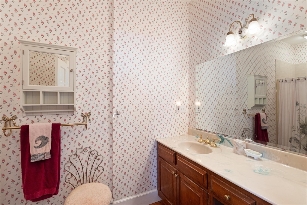 26 Cross Road Boxford, MA 01921 - Photo 34 of 41 a bathroom with a sink toilet and mirror
