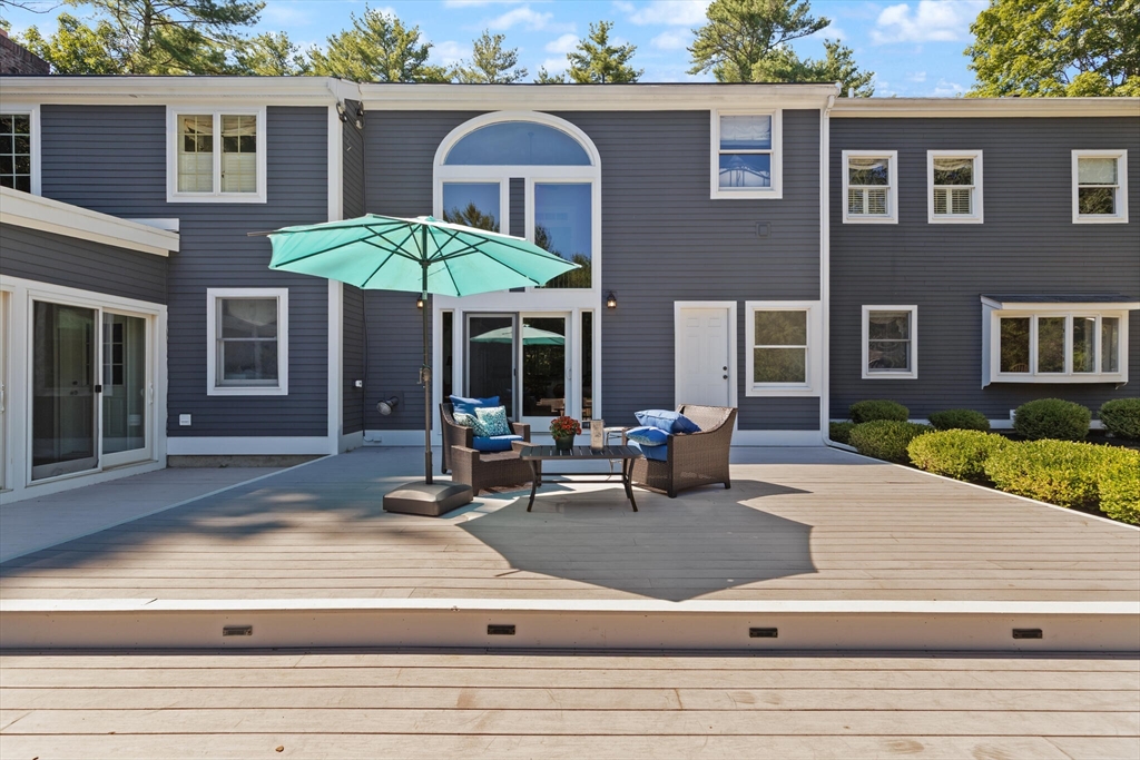 26 Cross Road Boxford, MA 01921 - Photo 36 of 41 a view of a brick house with a patio