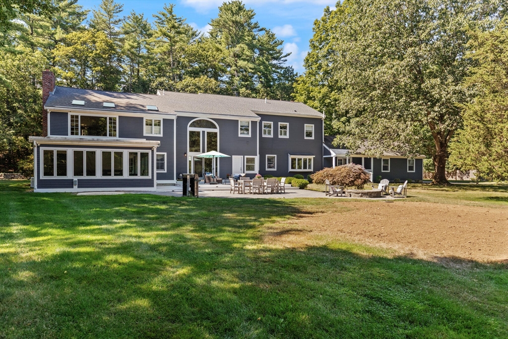 26 Cross Road Boxford, MA 01921 - Photo 37 of 41 a front view of a house with garden and trees