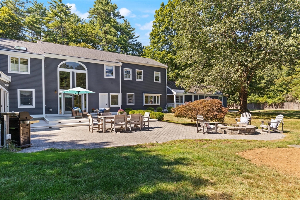 26 Cross Road Boxford, MA 01921 - Photo 38 of 41 a front view of a house with swimming pool and sitting area